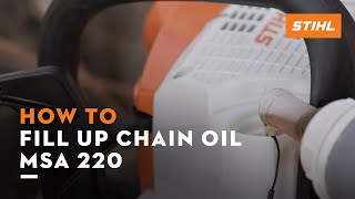 STIHL MSA 220  How to fill up the chain oil  Instruction [upl. by Cloris]