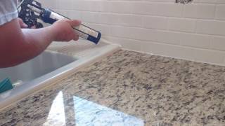 How to install silicone caulk around kitchen countertop shower bath tub etc [upl. by Shum]